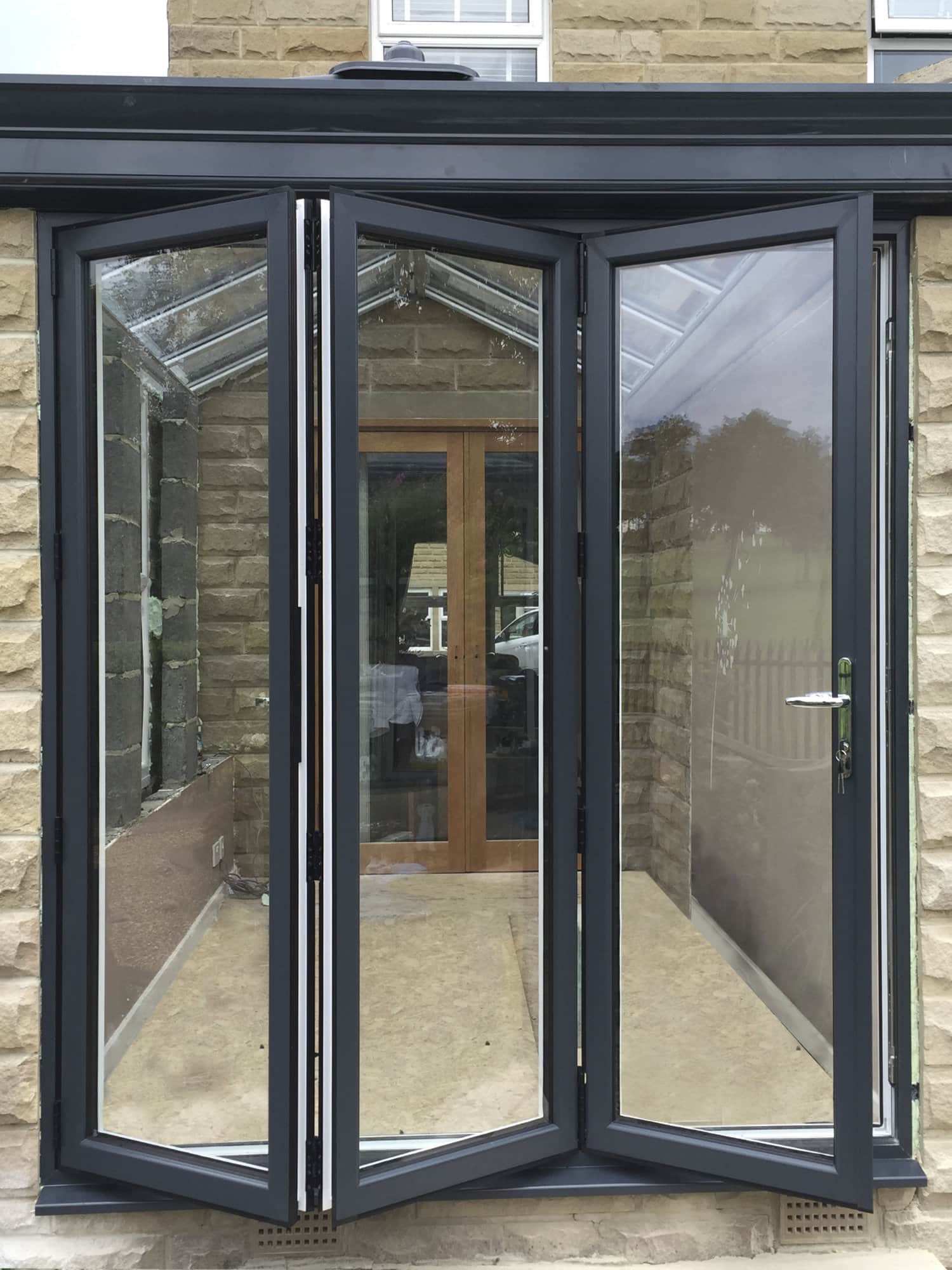 Aluminium bi-fold replacement windows and doors in Leeds home